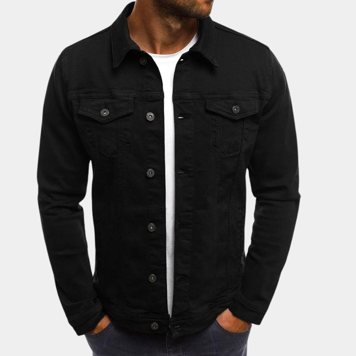 Man modelling classic black denim jacket over a white t-shirt