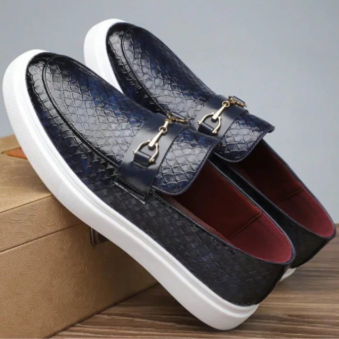 Navy croc-embossed leather loafers with gold bar trim and chunky white sole