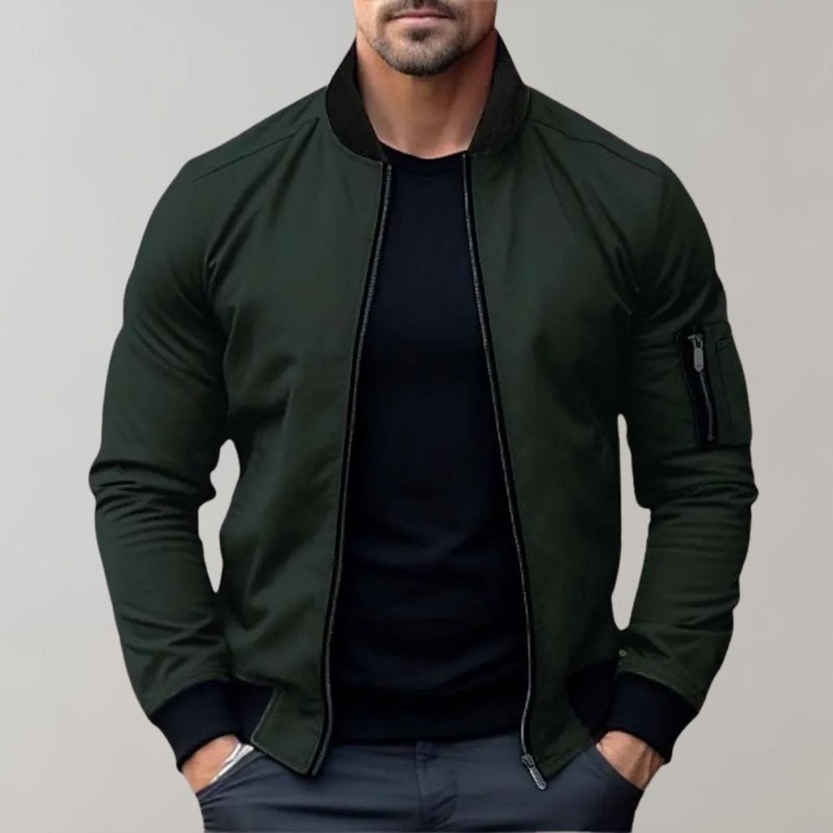 Olive green bomber jacket with black ribbed collar worn over black t-shirt