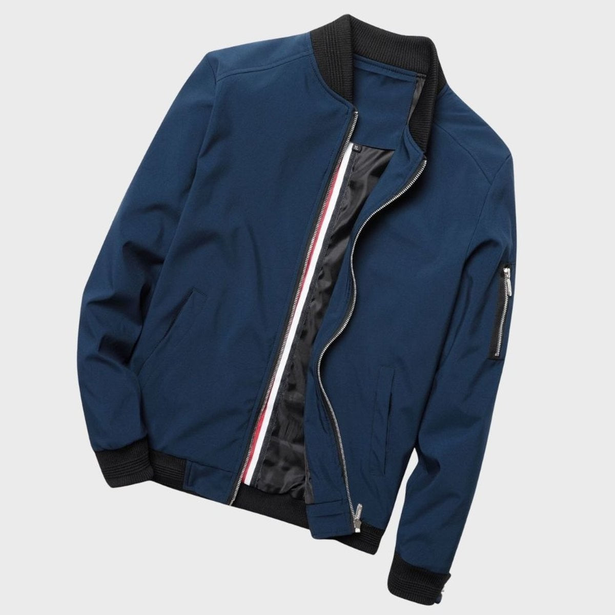 Navy blue zip-up bomber jacket flat lay revealing striped placket detail