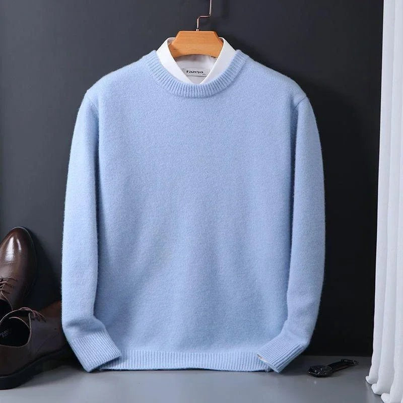 Pale blue mock-neck jumper hanging beside leather brogues and keys