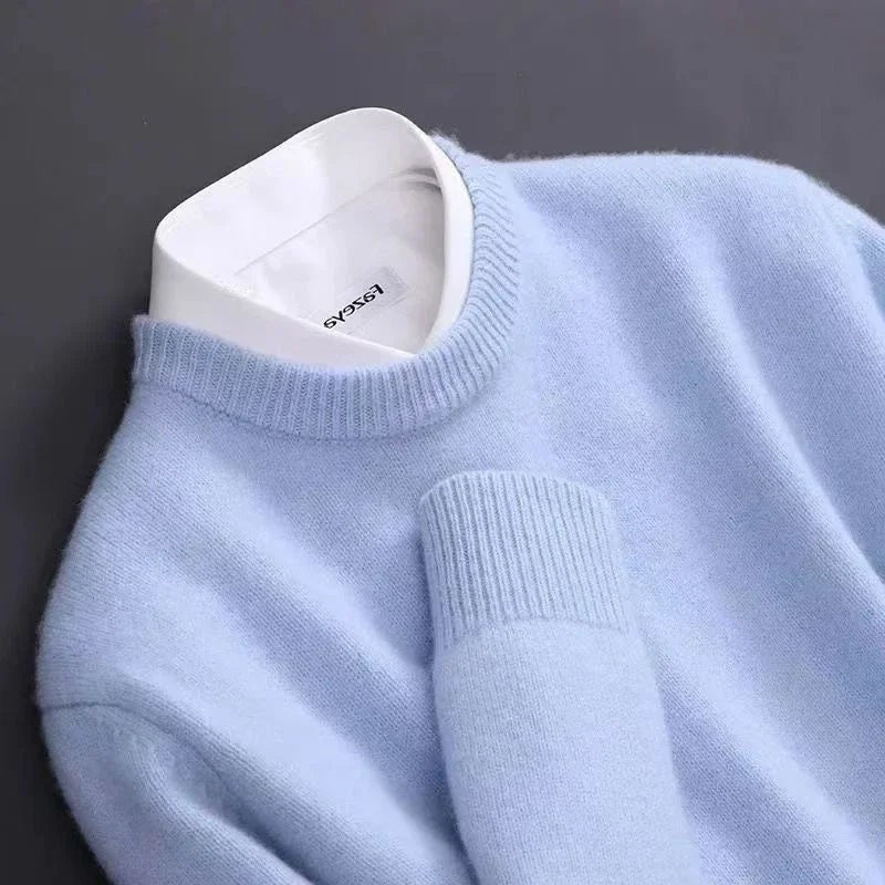 Close-up of pale blue jumper knit with ribbed cuff detail