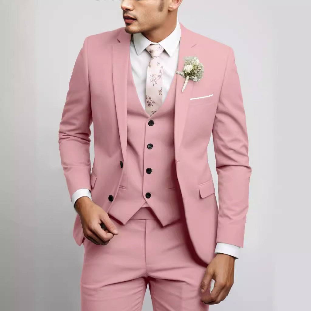 Dusty pink three-piece suit with waistcoat and floral wedding tie