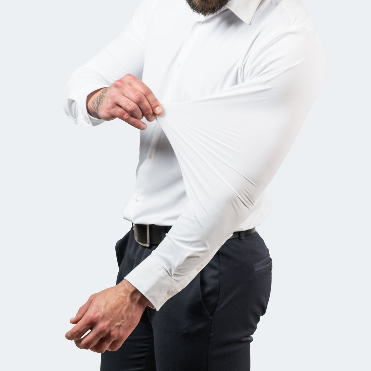 Close-up of white stretch shirt sleeve pulled to show fabric give