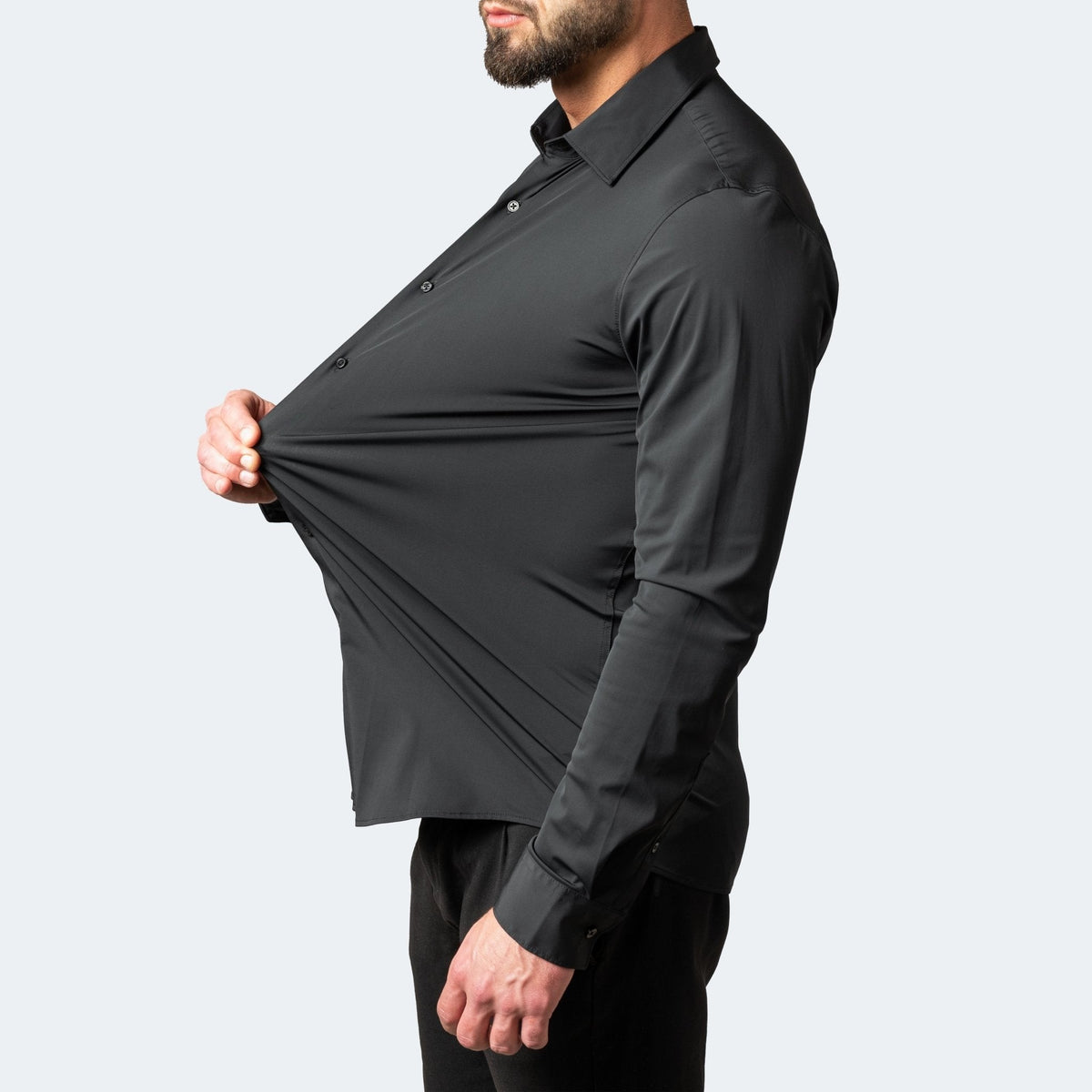 Black slim stretch shirt fabric stretched to reveal flexible weave