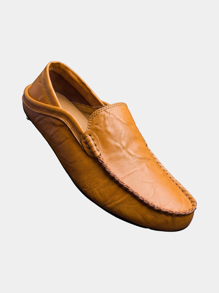 Tan leather slip-on moccasin with contrast stitched apron and driving sole