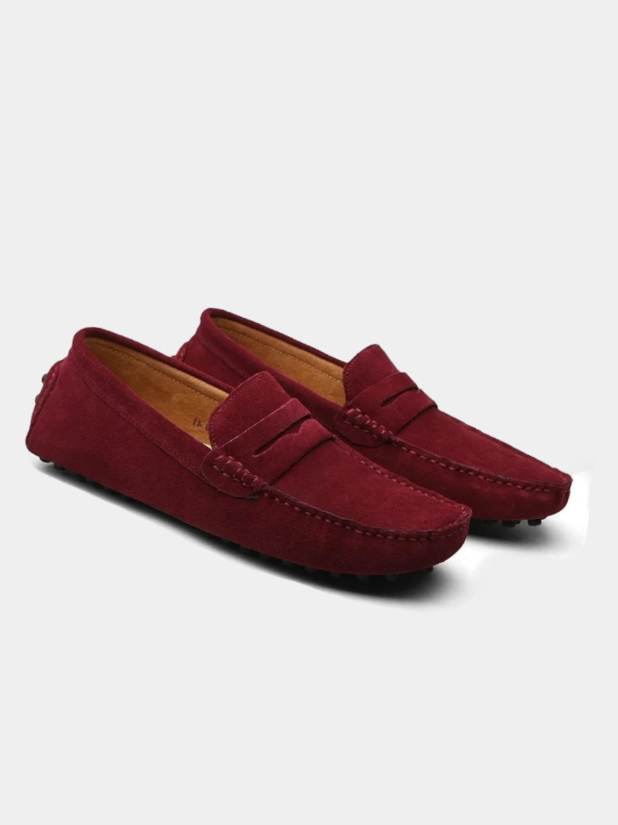 Burgundy suede penny loafers with contrast stitching and driving sole