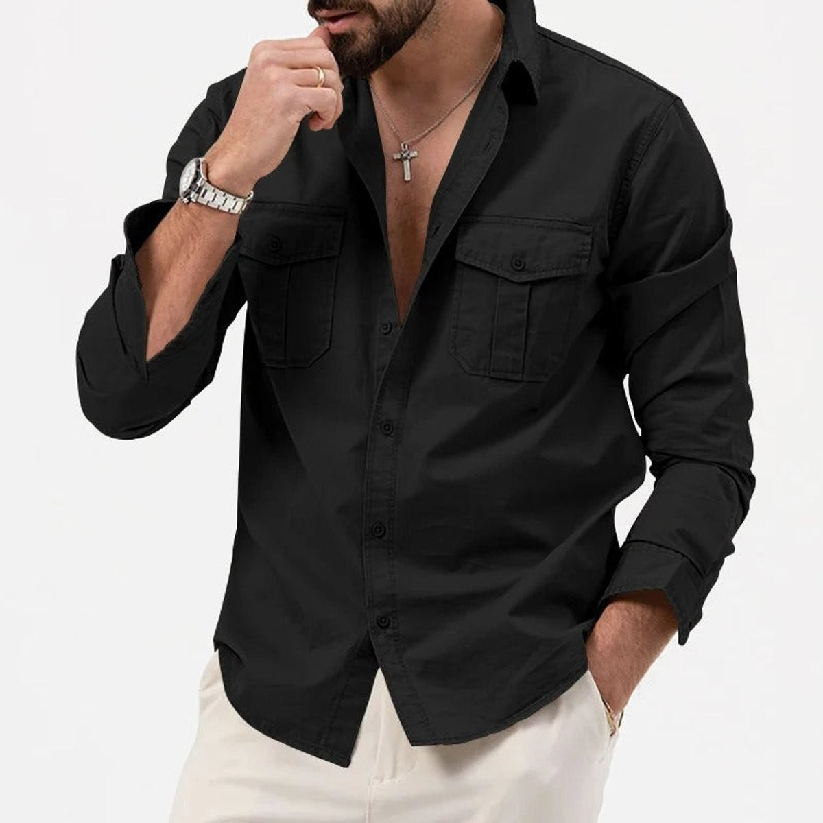 Man modelling black long-sleeve button-up shirt with twin chest pockets