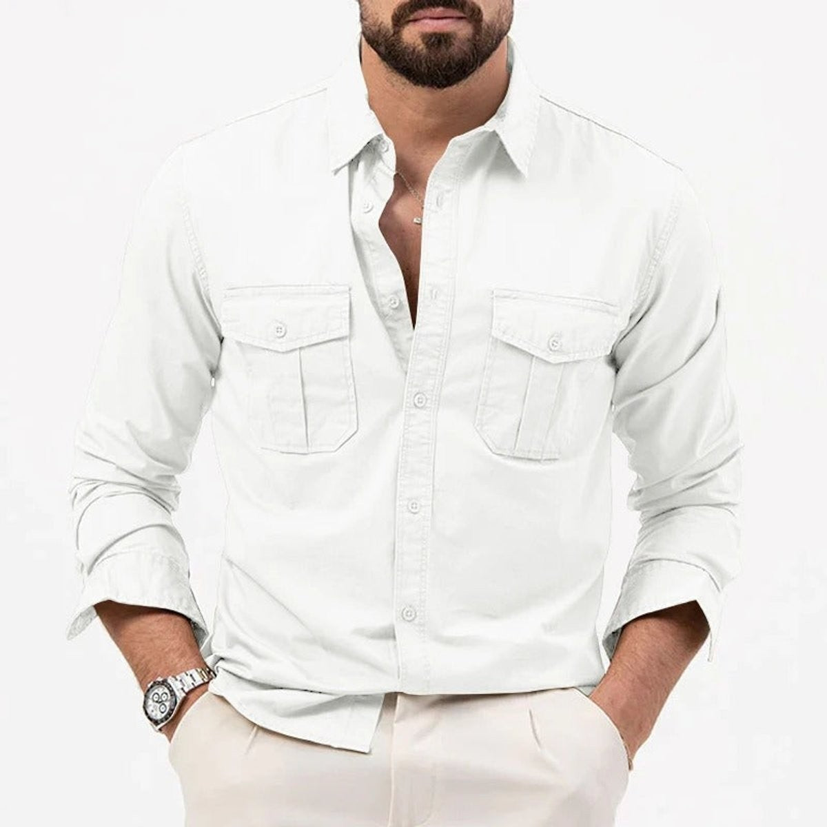 Close-up of black cotton shirt with flap pockets and rolled sleeve