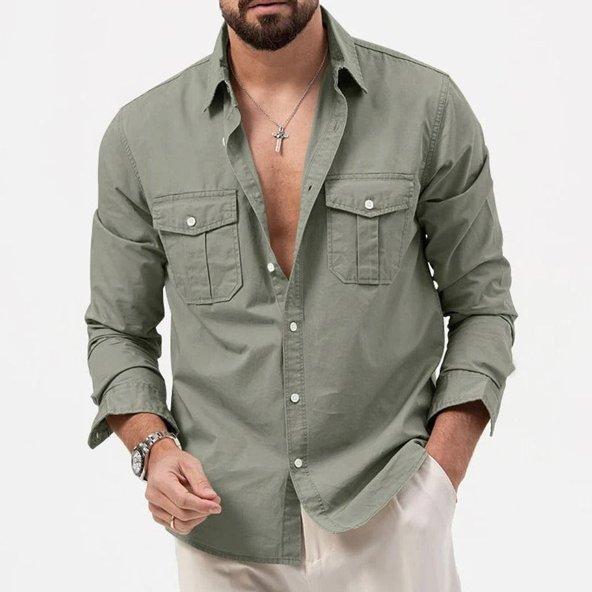 Close-up of sage green long-sleeve shirt showing pocket stitching detail