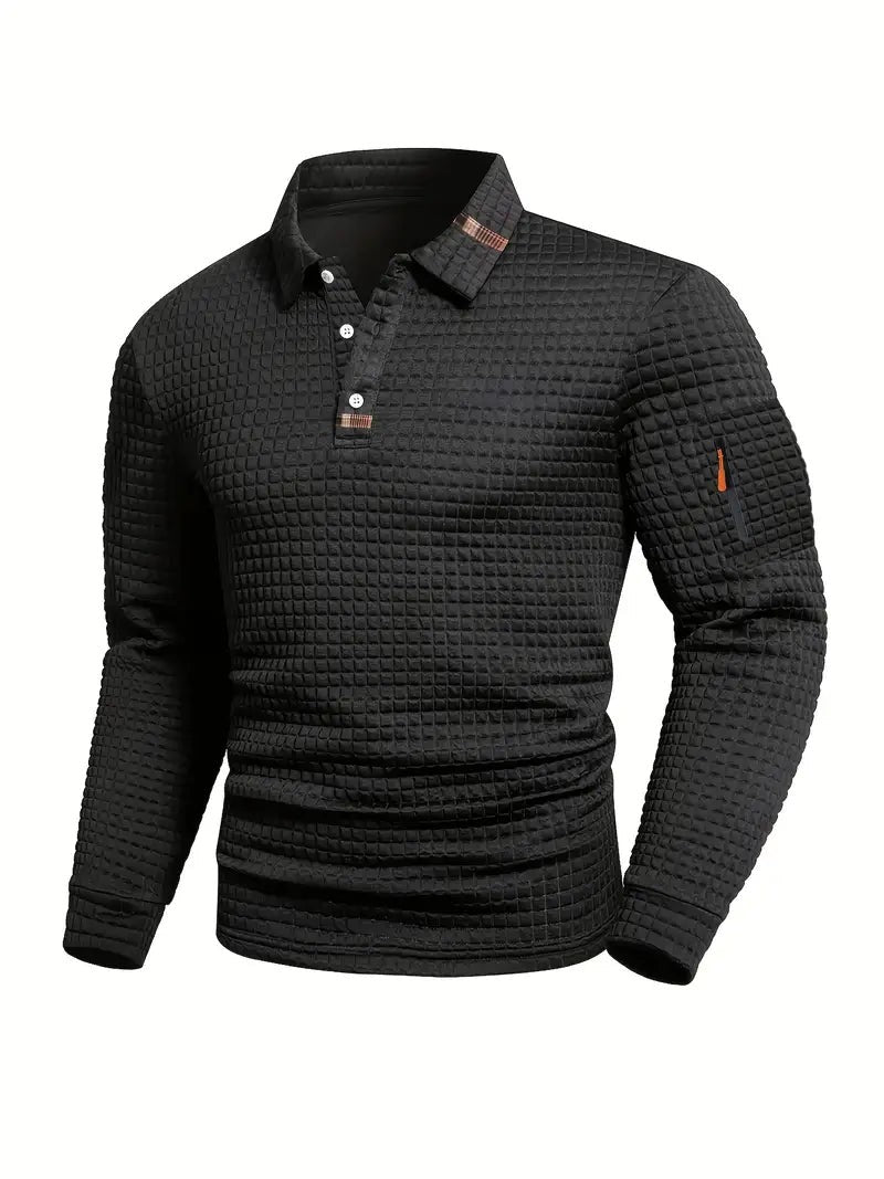 Men's black waffle-textured polo shirt featuring button placket and orange zip detail